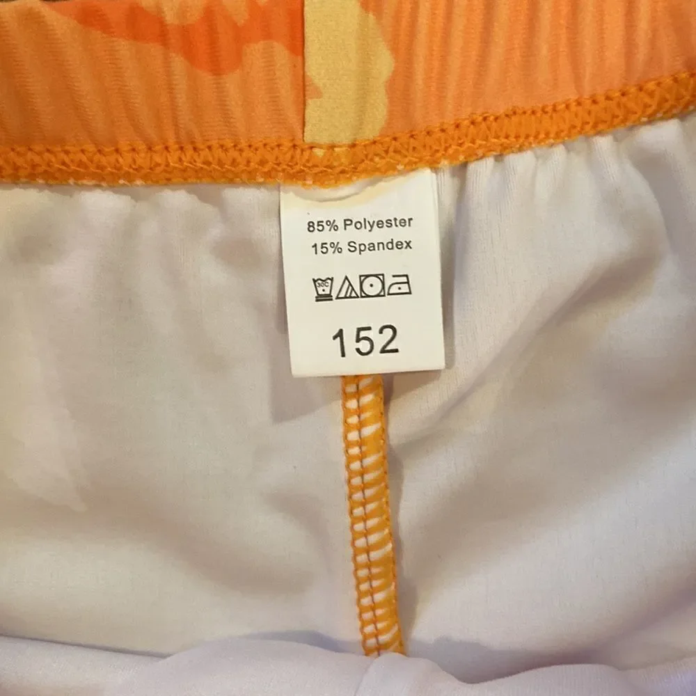 NWOT boys or girls swim shorts size 152 which is an 11/12 - dinosaurs, orange